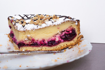 piece of cake with cherry filling on a white plate