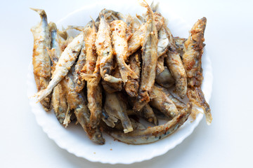 white plate with fried prawns