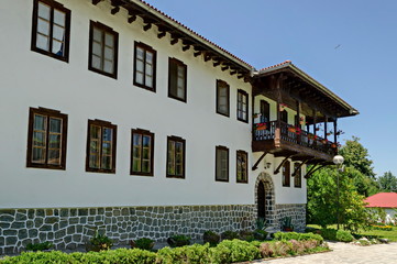 Part of exterior ancient monastic house in Klisura Monastery St. Cyril and St. Methodius, founded in the 12th century, mountain Balkan, near Varshets town, Bulgaria, Europe 