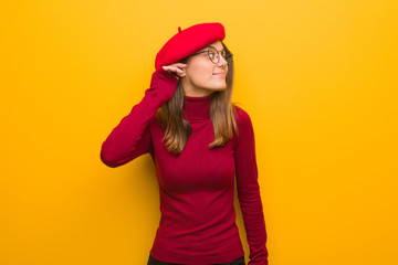 Naklejka premium Young french artist woman try to listening a gossip
