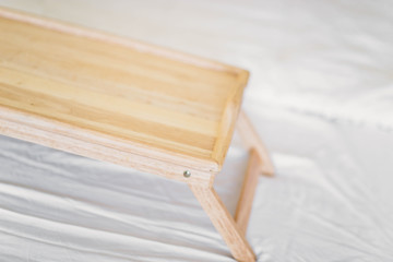 wooden table breakfast tray in bed