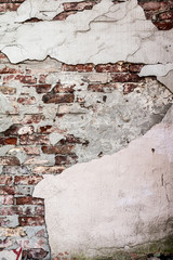 texture old brick wall with crumbling plaster and shattered, abstract background