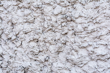 gray texture of a concrete wall, layer of decorative plaster, abstract background