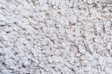 gray texture of a concrete wall, layer of decorative plaster, abstract background