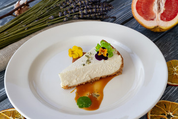 Dessert on a plate decorated with flowers and nuts