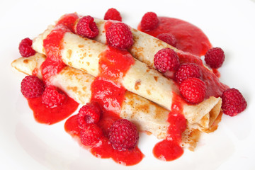 pancakes with strawberries, raspberries and berry sauce