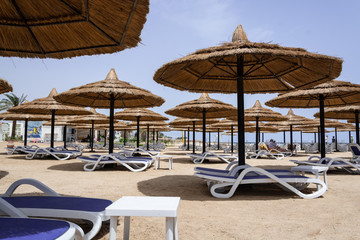 Straw umbrellas on the beach