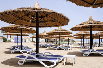 Straw umbrellas on the beach