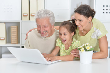 Portrait of grandfather, daughter and granddaughter together