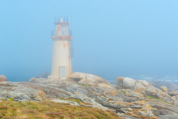 Fototapeta na wymiar Ligthhouse on a foggy day, Muxia in La Coruña, Spain