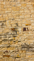 Background of old stone wall. The texture of the stone surface. Brickwork in the old European city. Pattern in retro style