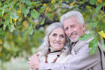 Close-up portrait of beautiful senior couple hugging