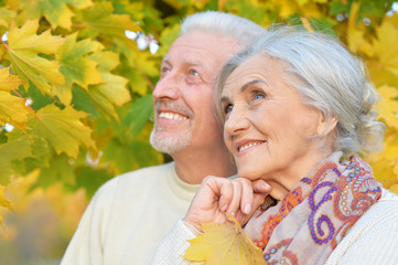 Close-up portrait of beautiful senior couple hugging