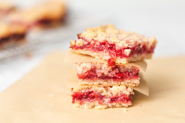Freshly Baked Strawberry Bar Cookies, Some Cooling on Wire Rack with some isolated in front on white countertop