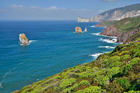 Coastline, behind rocky island Pan di Zucchero, Nebida, Golfo di Gonnesa, Sardinia, Italy, Europe