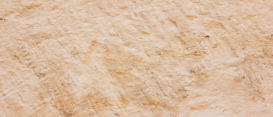 Background of the old wall. Texture of stone surface. Abstract background in retro style. Brown surface of solid material