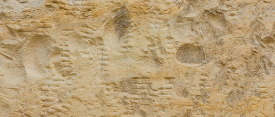 Background of the old wall. Texture of stone surface. Abstract background in retro style. Brown surface of solid material
