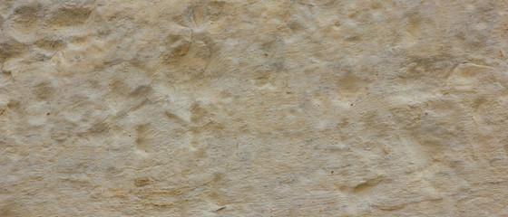 Background of the old wall. Texture of stone surface. Abstract background in retro style. Brown surface of solid material