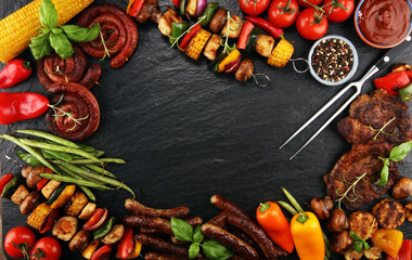 Assorted delicious grilled meat and skewer with vegetable on rustic table