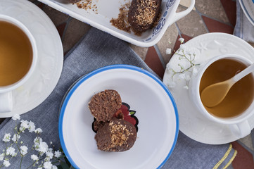 Traditional Russian cake with cocoa in the shape of a ball. Served breakfast table. Top view. Tea and dessert.