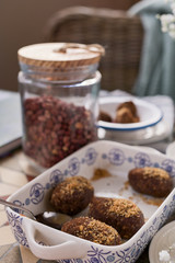 Traditional Russian cake with cocoa and chocolate in the shape of a ball. Served breakfast table. Cozy atmosphere at home.