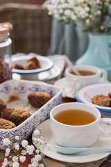 Traditional Russian cake with cocoa and chocolate in the shape of a ball. Served breakfast table. Cozy atmosphere at home.