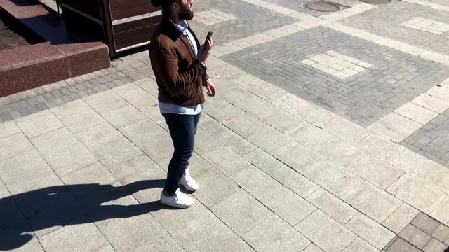Man drops smartphone outdoors