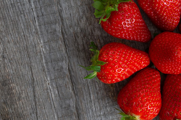 red strawberry decomposed gray background