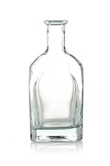 transparent empty glass bottle on a white background, isolated with copy space