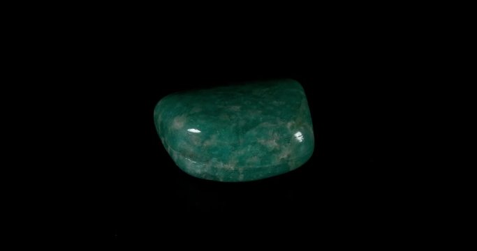 Amazonite Mineral Turning on Black