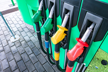 Gas and petrol station. Guns for refueling at a gas station. Detail of a petrol pump different...