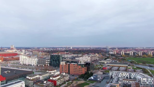 Aerial tilt of housing area in western Malmo, Sweden. A cloudy day in the afternoon.
