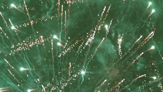 Large and Small Fireworks Bursting in Sky During Finale TILT UP SLOW MOTION