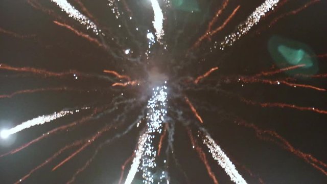 Following Fireworks Rockets Up and Exploding TILT UP SLOW MOTION