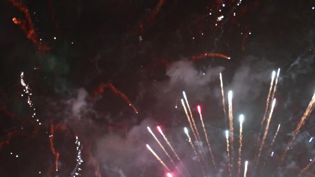 Multicolored Fireworks During Finale TILT DOWN SLOW MOTION