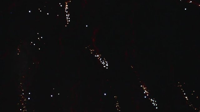Double Fireworks Explosion in Night Sky TILT DOWN SLOW MOTION