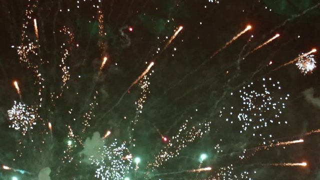 Large and Small Fireworks Bursting in Sky During Finale TILT UP