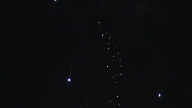 Fireworks Explosions and Smoke in Sky TILT UP SLOW MOTION