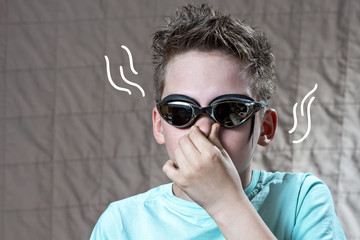 portrait of a boy in swimming goggles