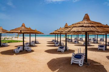 Straw umbrellas on the beach