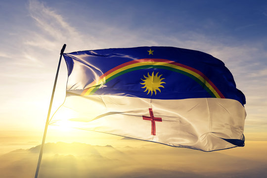Pernambuco state of Brazil flag waving on the top sunrise mist fog