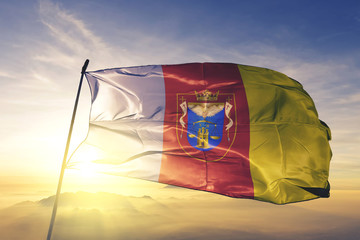 Piura region of Peru flag waving on the top sunrise mist fog