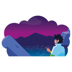 man contemplating horizon in lake and mountains at night scene