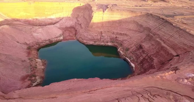 desert Oasis Hidden lost spring lake in desert negev of Israel Agam timna. Aerial shoot above Timna, Red cliff brown mountain rocks in the middle of the Arava, Kibbutz Samar and Eilat springs.