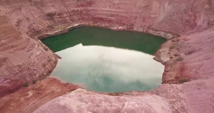 Desert negev of Israel Hidden lost spring lake Agam timna. Aerial shoot above desert Oasis at Timna, Red cliff brown mountain rocks in the middle of the Arava, Kibbutz Samar Eilat springs.
