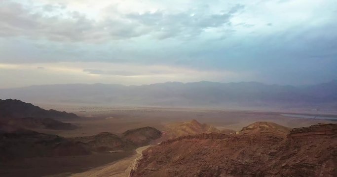Panoramic 360 view over Negev desert of Israel. Arava Desert In South Israel. Top hill rock mountains blue sky and clouds.