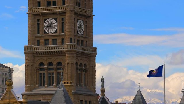A close up of the clock on top of the old Salt Lake City courthouse on beautiful spring afternoon.
