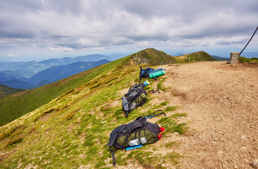 Obraz premium Tourist backpack in mountains landscape