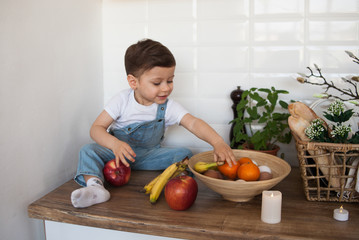 Fototapeta premium Kid having a table full of organic food. 