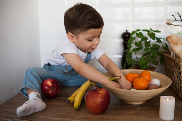 Fototapeta premium Kid having a table full of organic food. 